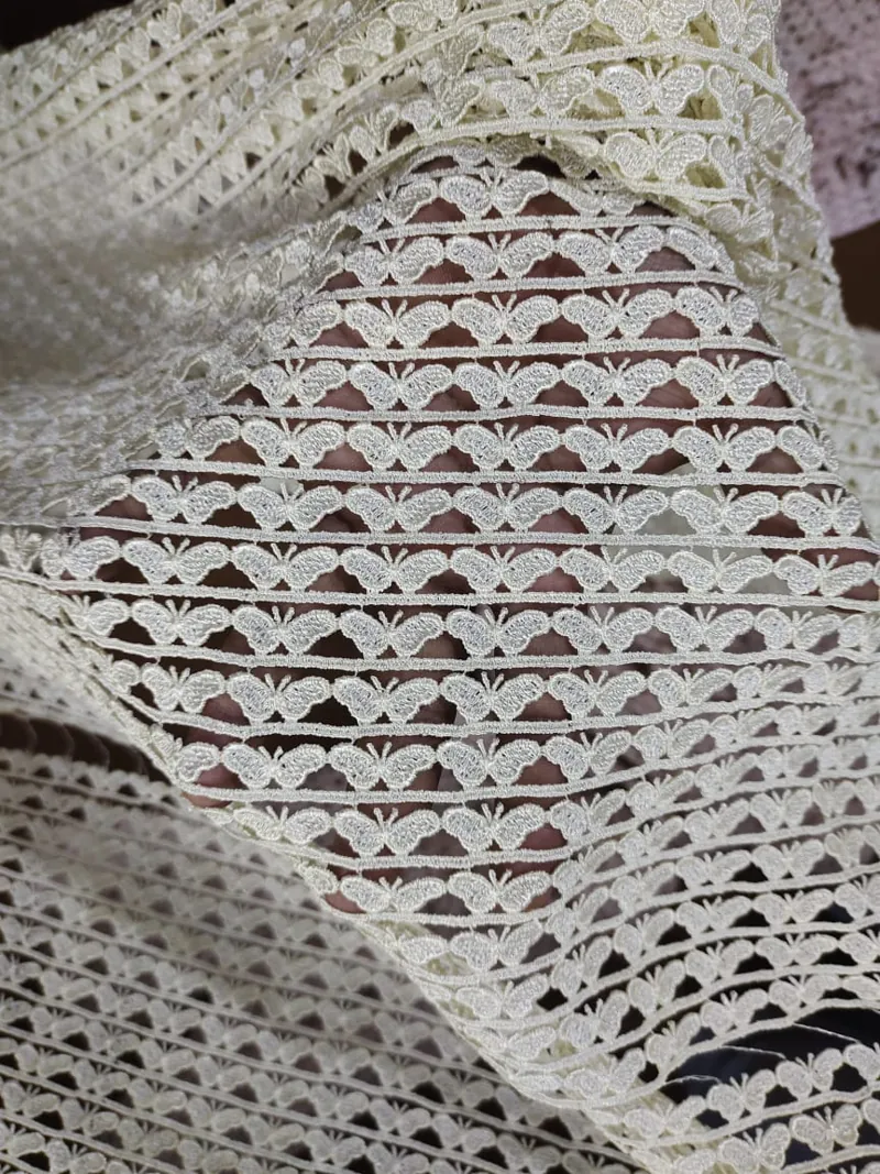 Shuttle embroidery machine producing guipure lace at Decent Lace Trader, Faisalabad