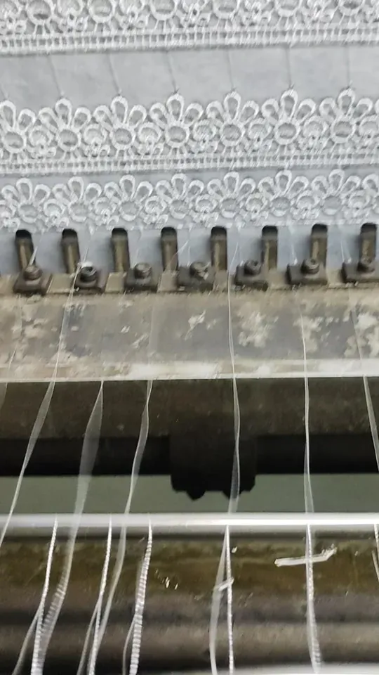 Guipure lace production on shuttle machines in Faisalabad