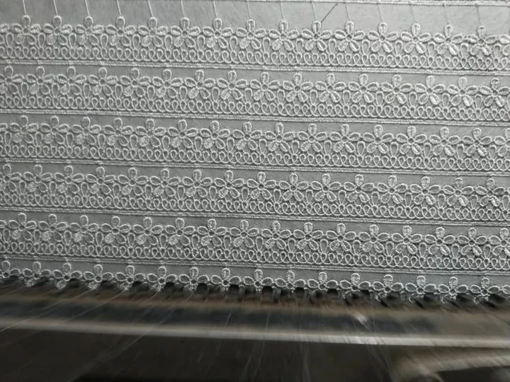Guipure lace production on shuttle machines in Faisalabad